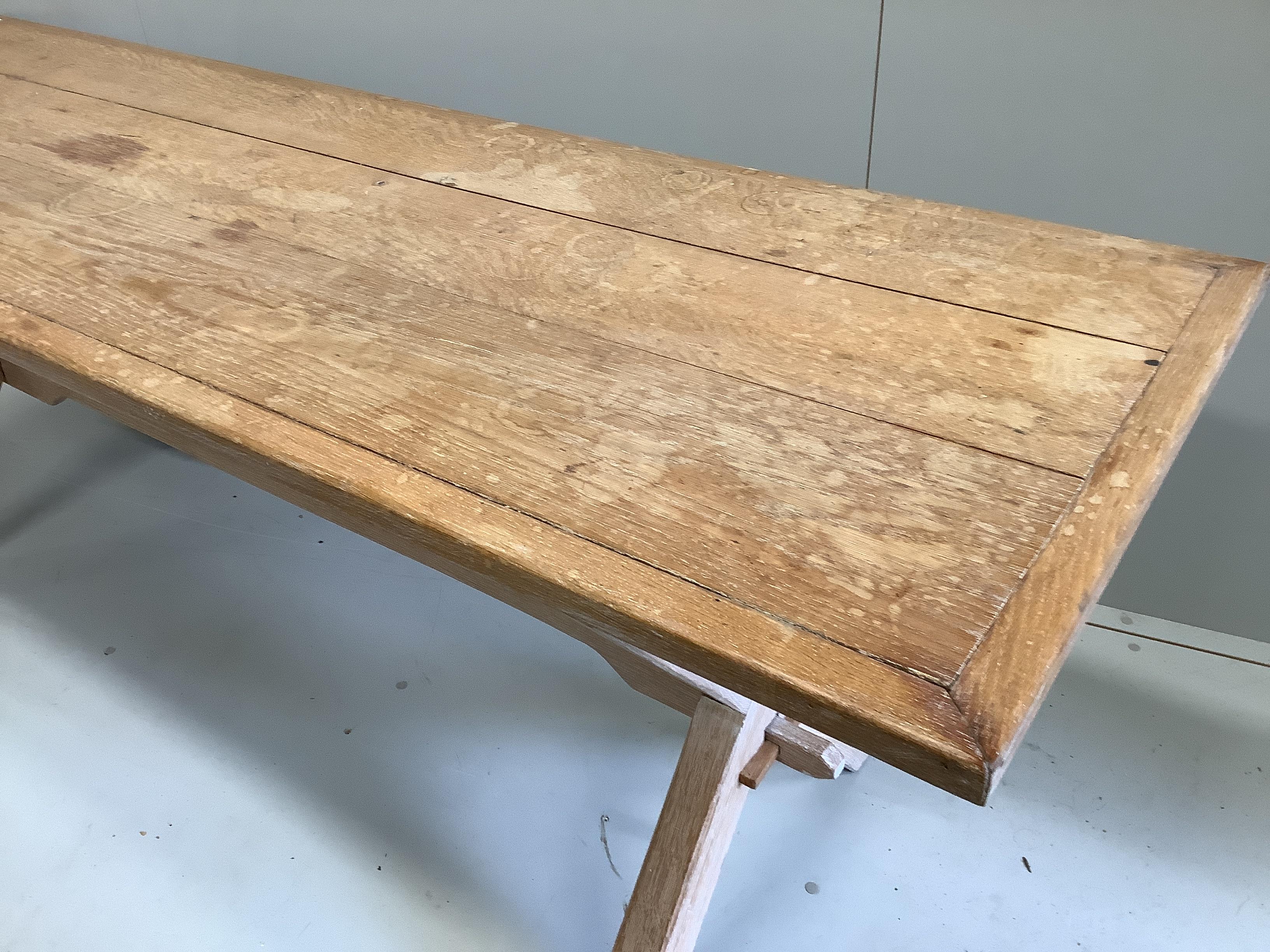 An 18th century style rectangular bleached oak tavern table, length 205cm, width 67cm, height 74cm